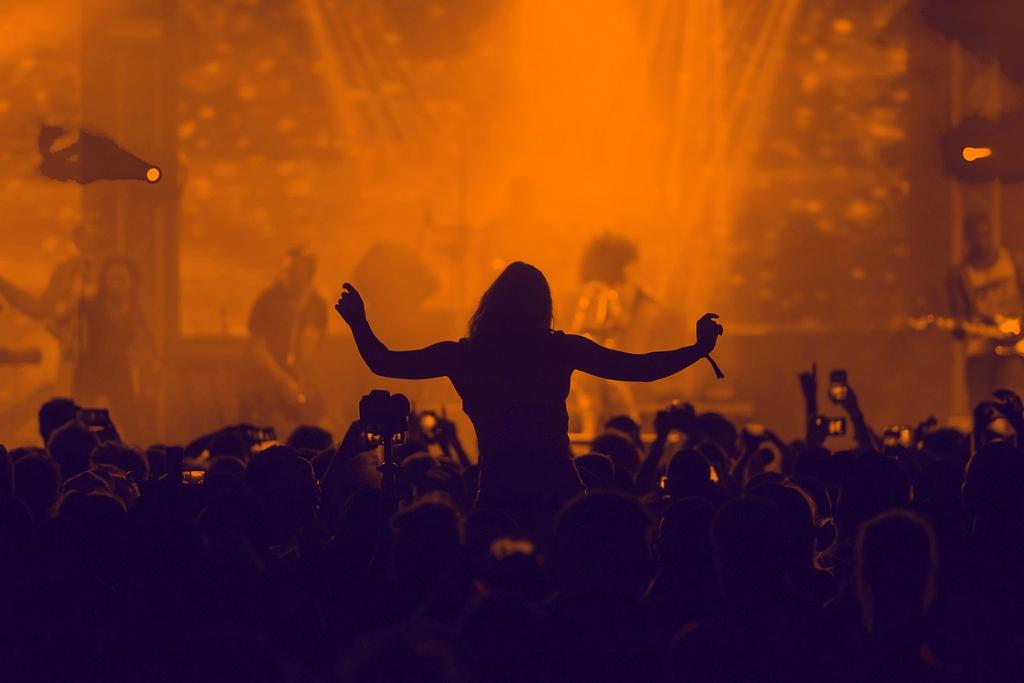 Concert stage with dramatic lighting and crowd